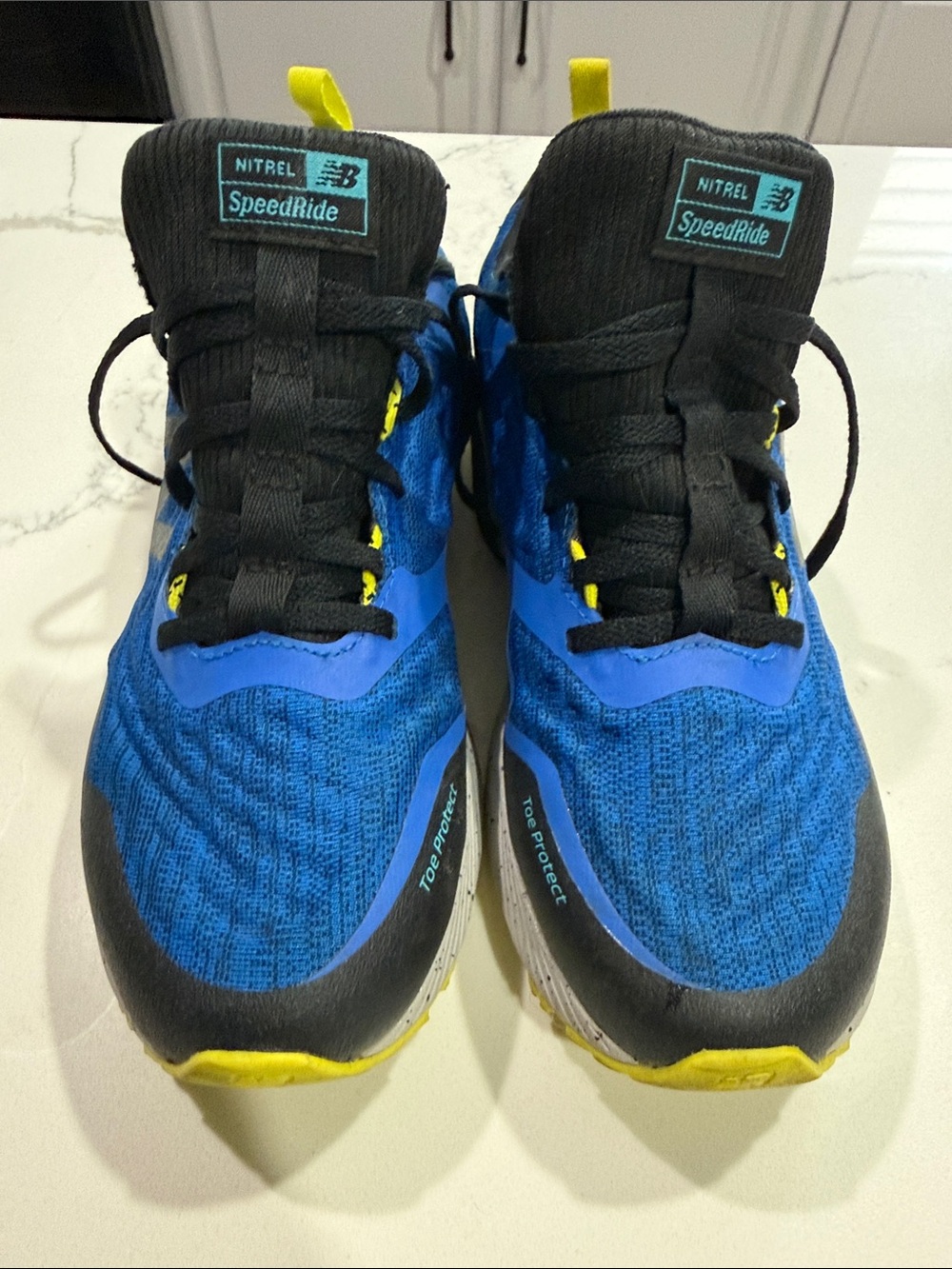 New Balance Blue and Black Men’s Trail Running Shoes with Yellow Accents